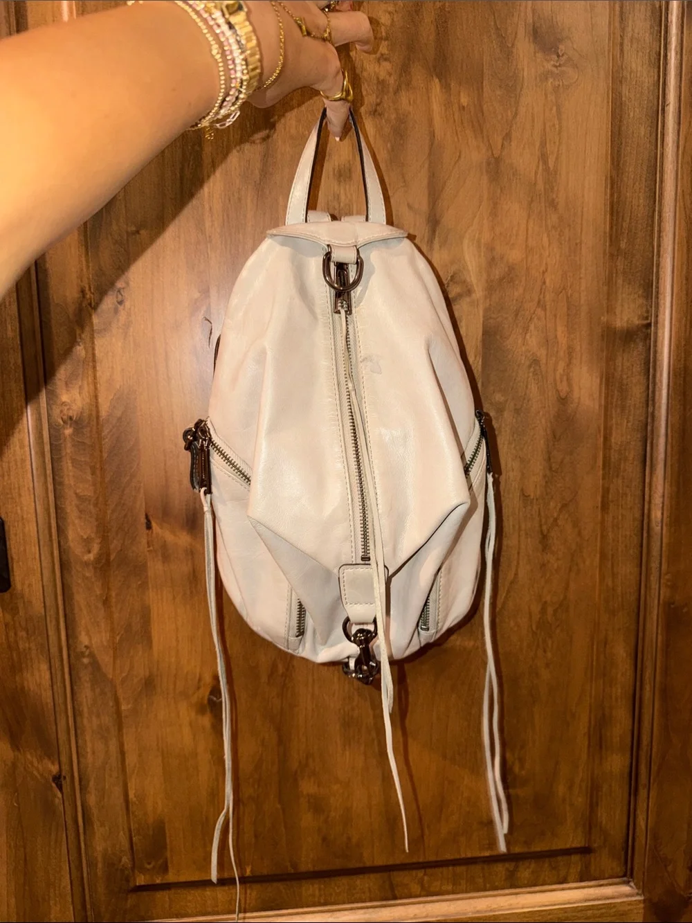 Rebecca Minkoff Ivory Leather Backpack with Gunmetal Hardware slightly worn.